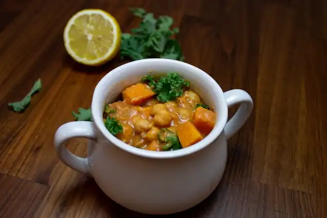 Curried_Chickpeas_with_Fresh_Cilantro_Spicy_Curry_Treat_Savory_Chickpea_Dish_Flavorful_Herb_Aromatic_Delight_Healthy_Cuisine_Nutritious_Recipe_Wholesome_Deliciousness_Ayurvedic_Cooking_Fresh_Cilantro_Aroma_Satisfying_Meal_Vegan_Fare_Ayurvedic_Food_Ayurveda